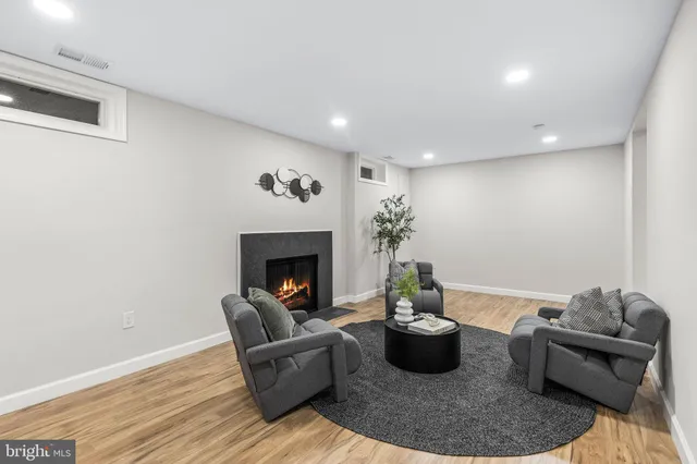 a view of a brick house with windows and wooden fence