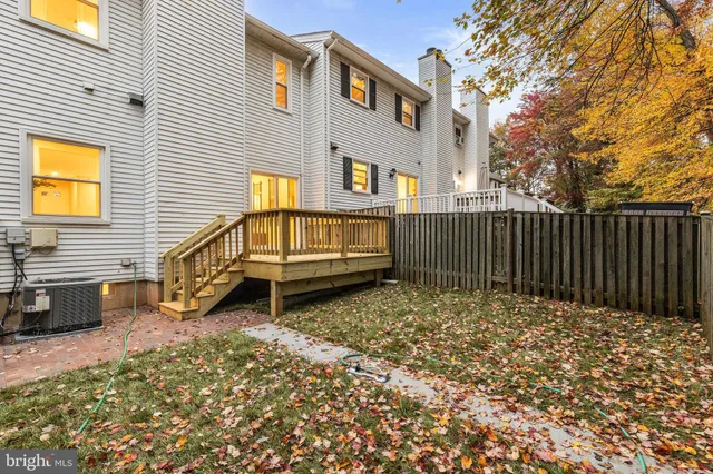 a view of balcony with wooden floor and fence