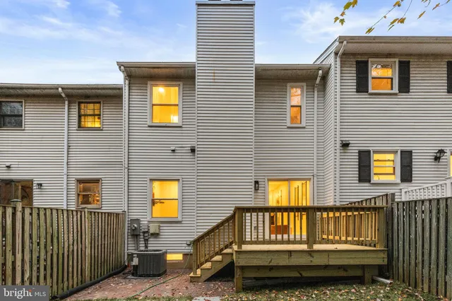 a garden view with wooden fence