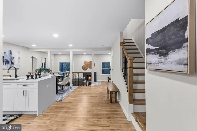 a kitchen with a sink a stove a refrigerator and cabinets