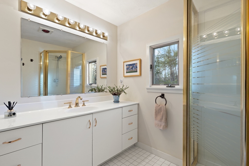 175 Mountain Street Sharon, MA 02067 - Photo 12 of 28 a spacious bathroom with a double vanity sink mirror and shower