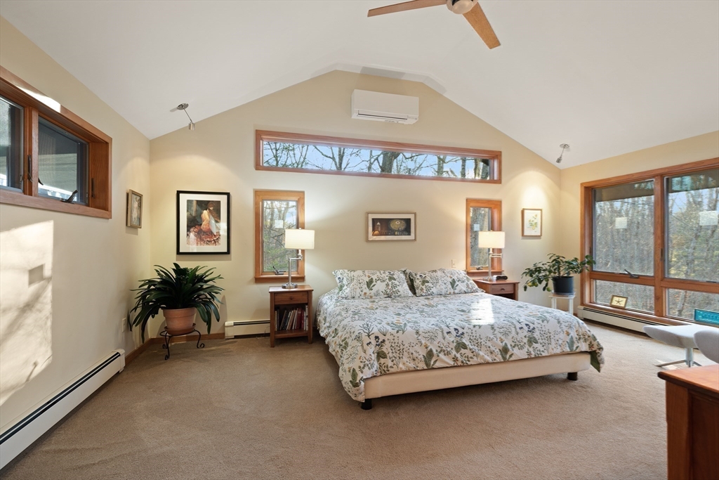 175 Mountain Street Sharon, MA 02067 - Photo 14 of 28 a bedroom with a bed couch and large window