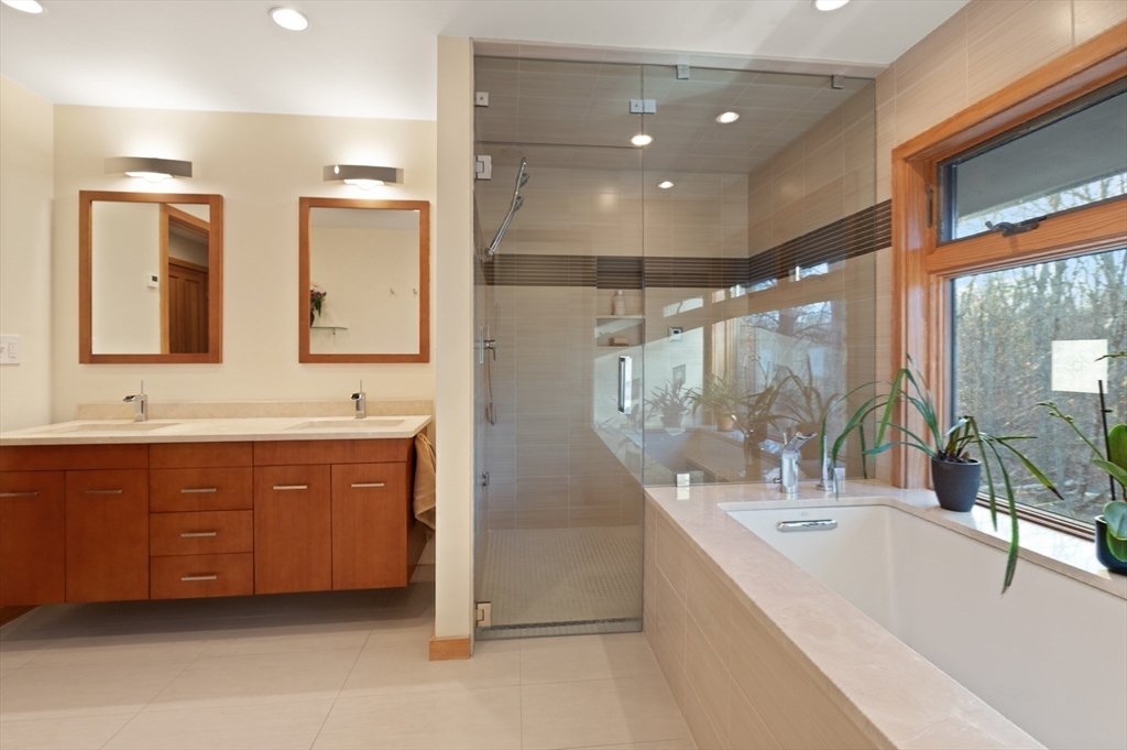 175 Mountain Street Sharon, MA 02067 - Photo 16 of 28 a bathroom with a double vanity sink mirror and bathtub