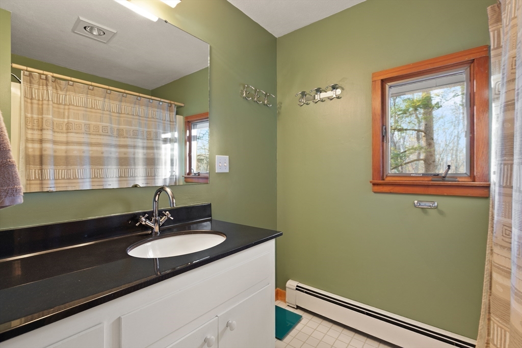 175 Mountain Street Sharon, MA 02067 - Photo 19 of 28 a bathroom with a sink and a mirror