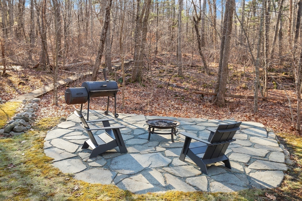 175 Mountain Street Sharon, MA 02067 - Photo 23 of 28 a view of a yard with table and chairs