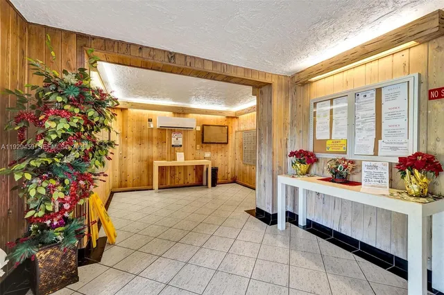 a living room with furniture and flowers