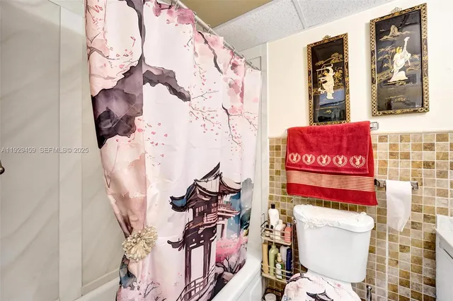 a view of a living room filled with furniture and furniture