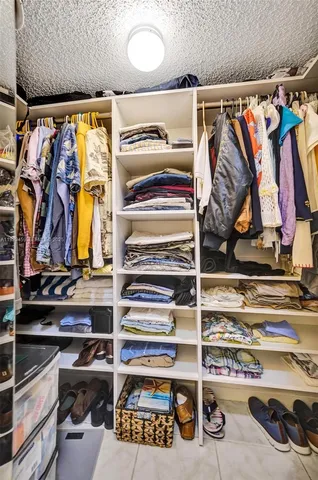 a balcony with furniture and potted plant