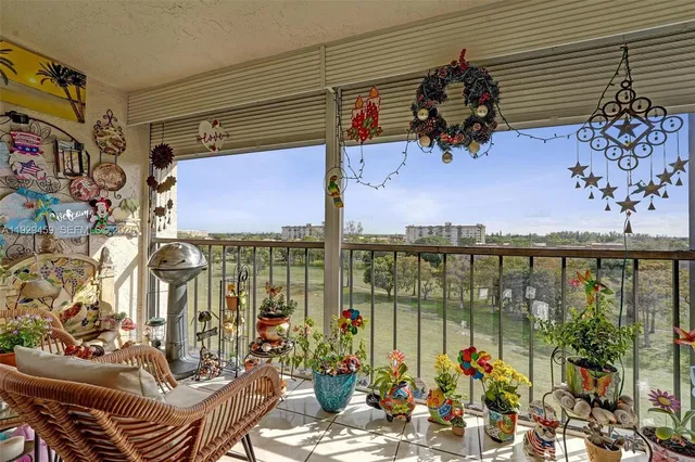 a view of a tables and chairs under an umbrella