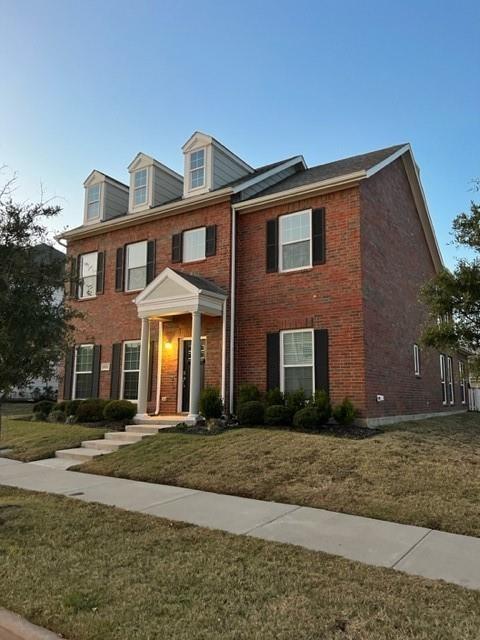a front view of a house with a yard