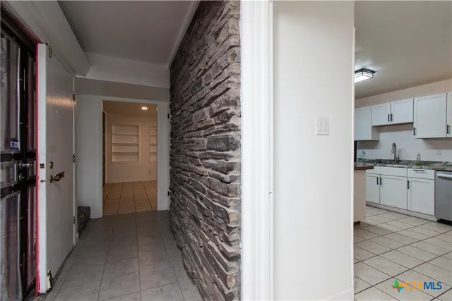 a view of a kitchen and utility room