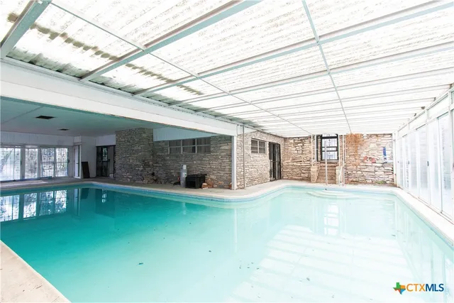 a view of a living room with a large window