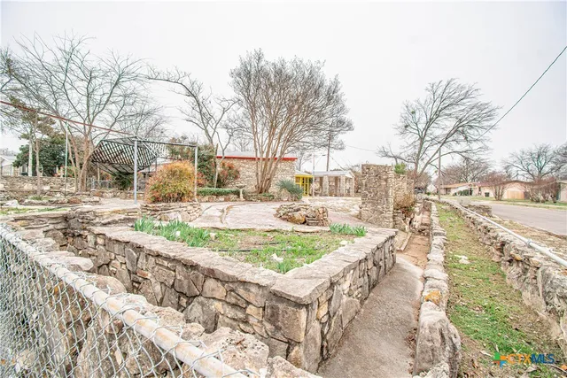 a view of yard covered with snow in front of house