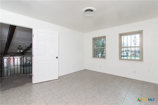 an empty room with windows