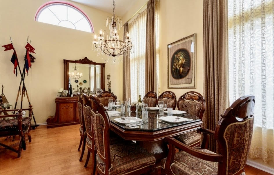 671 Wintergreen Circle Naperville, IL 60540 - Photo 4 of 17 a view of a dining room with furniture and chandelier