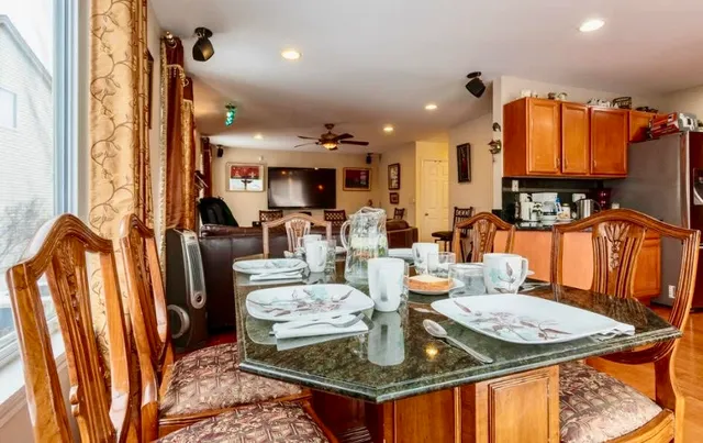a living room with fireplace furniture and a flat screen tv