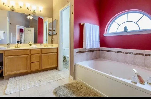 a bathroom with a bathtub and a sink