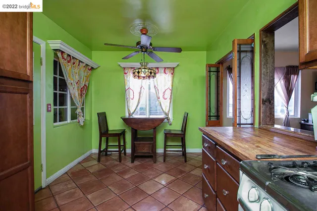 a view of a dining room with furniture and window