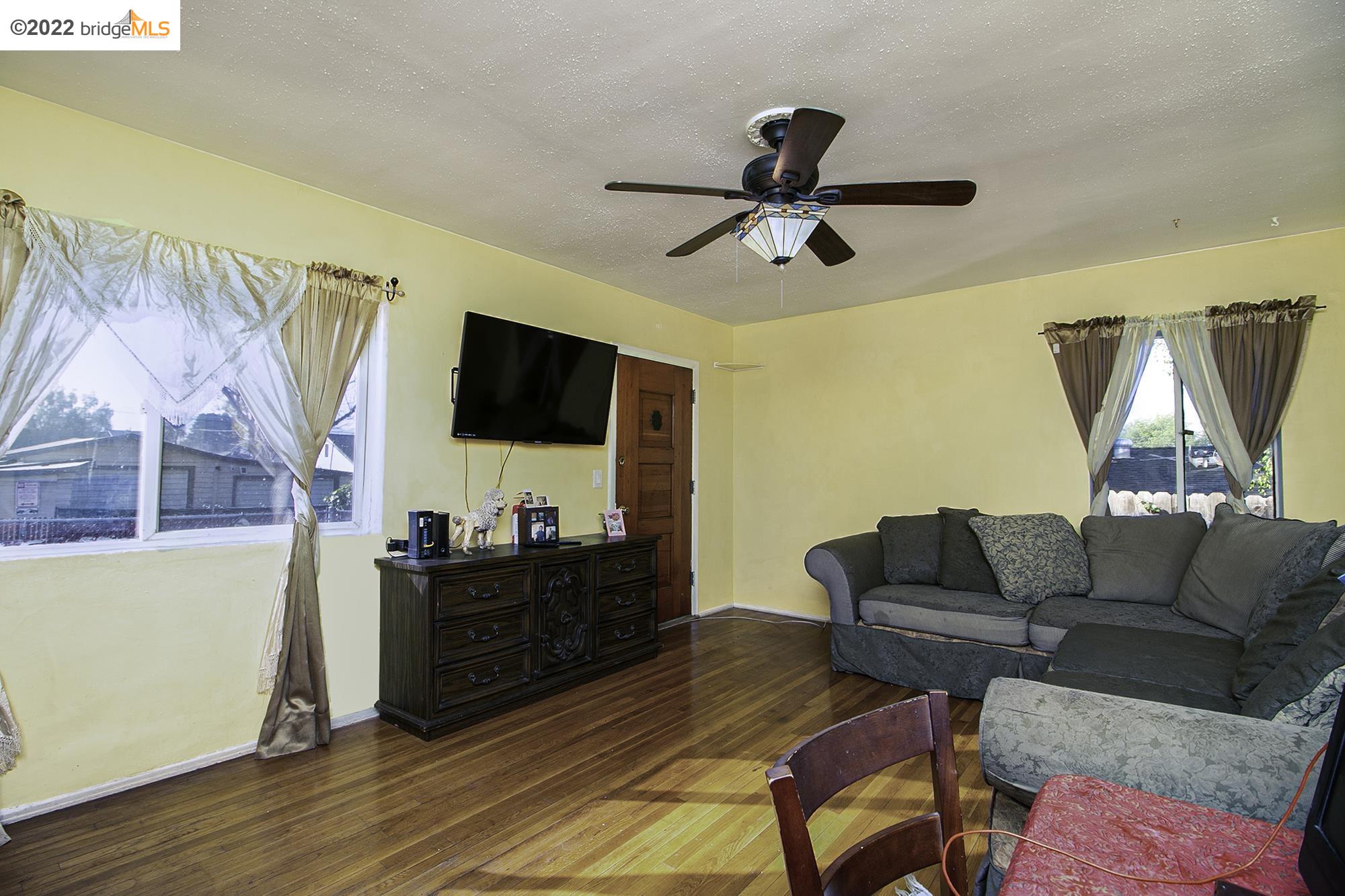 7755 Forsythe Street Tujunga, CA 91042 - Photo 15 of 15 a living room with furniture and a flat screen tv