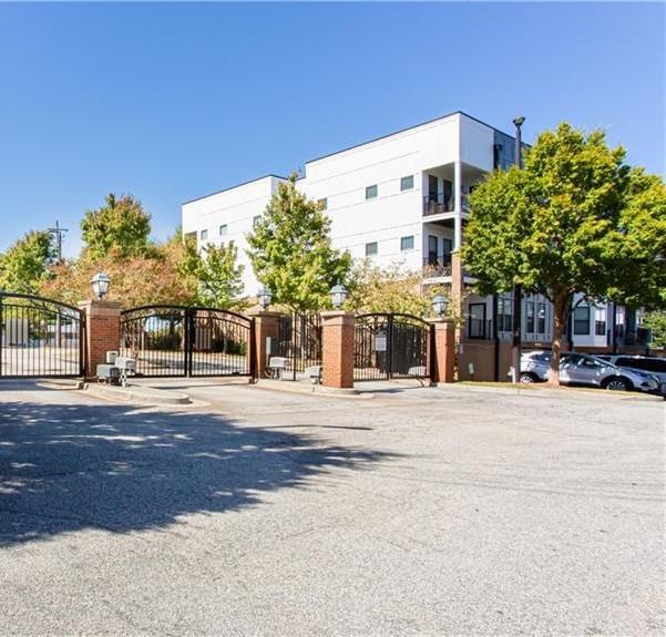 898 Oak Street Southwest, Unit 3426 Atlanta, GA 30310 - Photo 1 of 1 a front view of a building with a garden