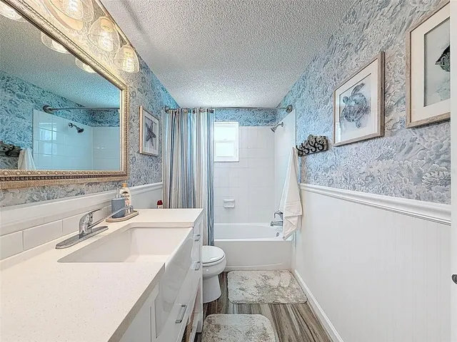 a view of house with swimming pool yard and outdoor seating