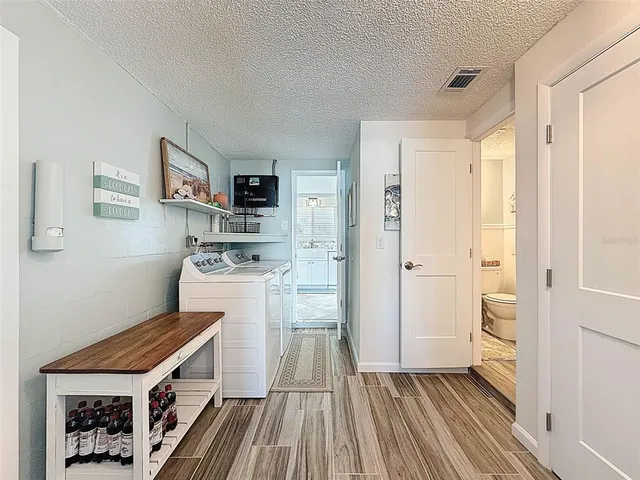a bedroom with a bed and a ceiling fan