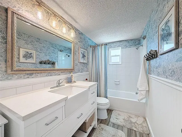 a view of a swimming pool with furniture