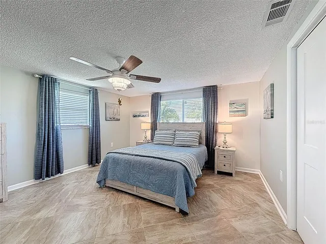 a view of a swimming pool with seating space