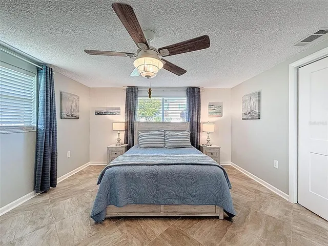 an aerial view of a house with a swimming pool yard and outdoor seating