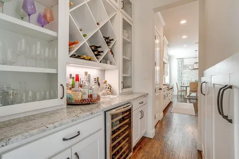 a kitchen with stove and cabinets