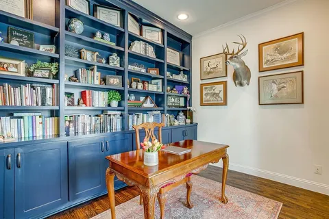 a view of a workspace with bookshelf