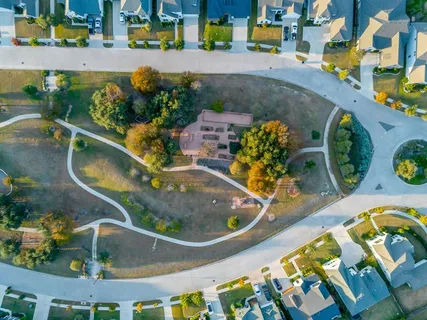 an aerial view of a house with a swimming pool