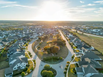 an aerial view of residential houses with outdoor space