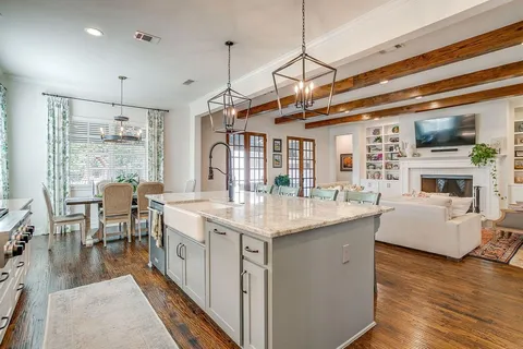 a open kitchen with stainless steel appliances granite countertop a stove and cabinets