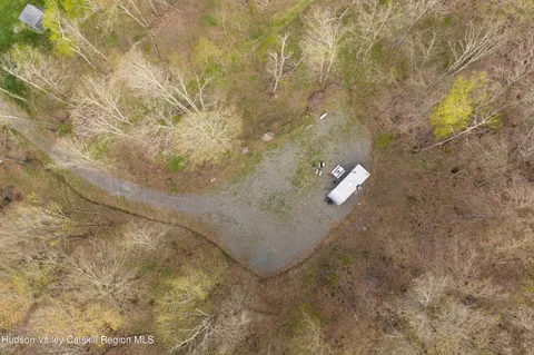 a aerial view of a house with a yard