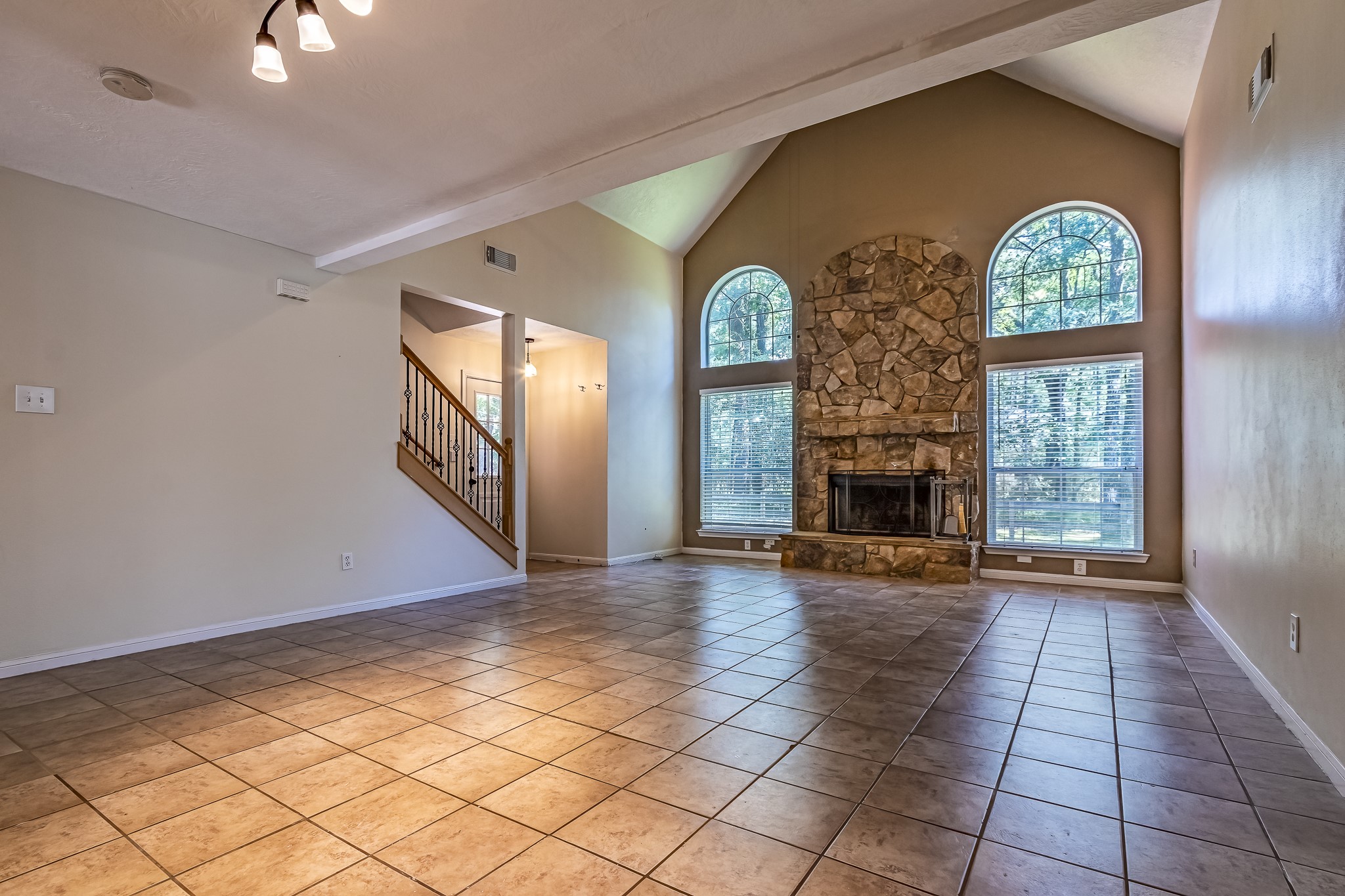 12 Quiet Wind Trinity, TX 75862 - Photo 13 of 47 an empty room with windows and fireplace