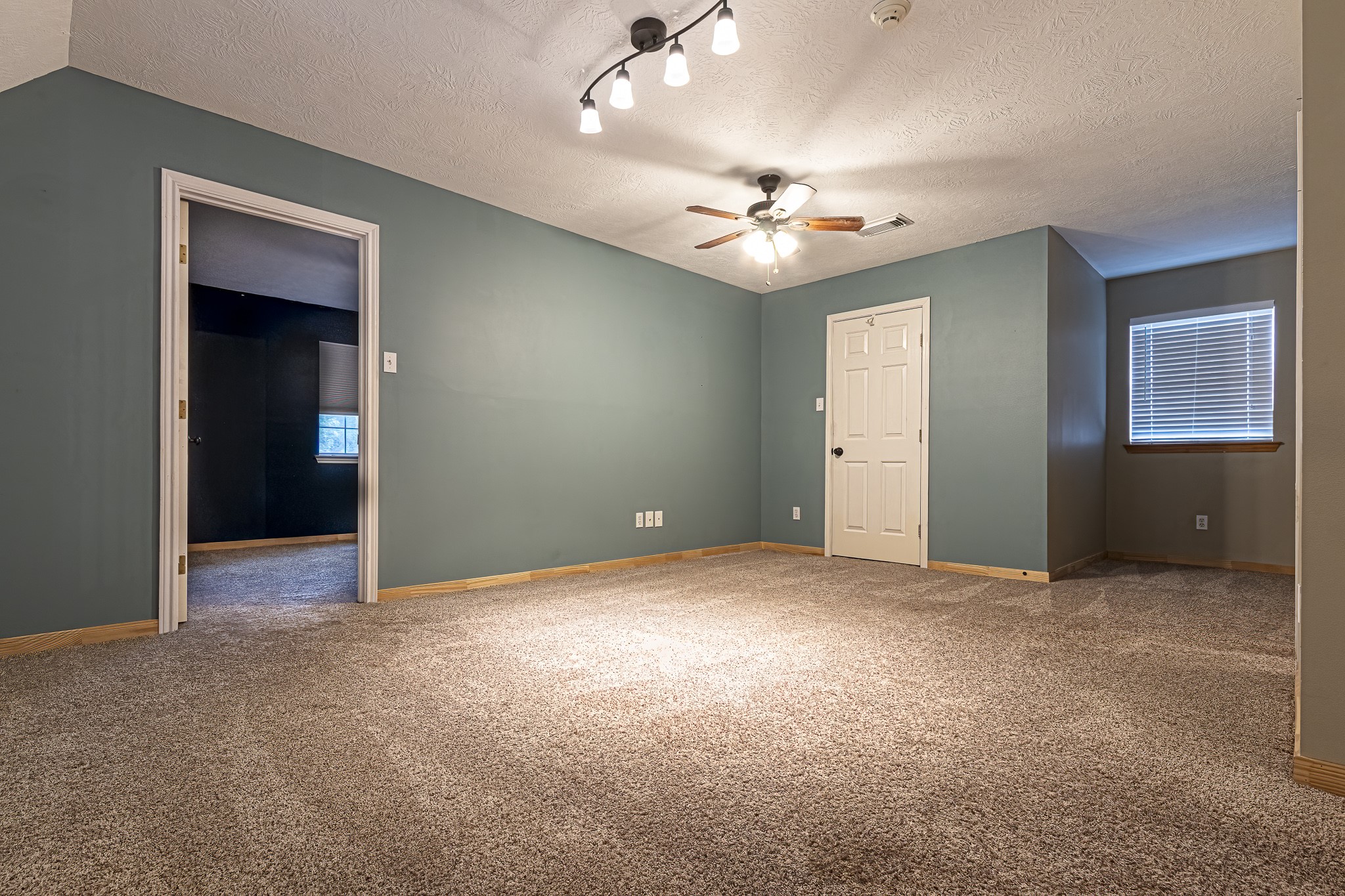 12 Quiet Wind Trinity, TX 75862 - Photo 22 of 47 an empty room with closet and a ceiling fan