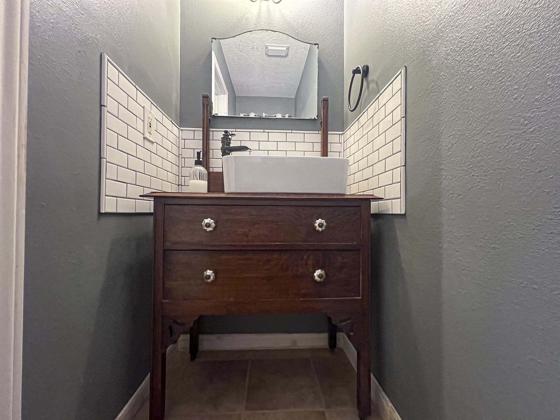 12 Quiet Wind Trinity, TX 75862 - Photo 24 of 47 a bathroom with a mirror a sink and a toilet