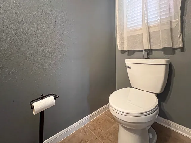a kitchen with granite countertop white cabinets stainless steel appliances and sink