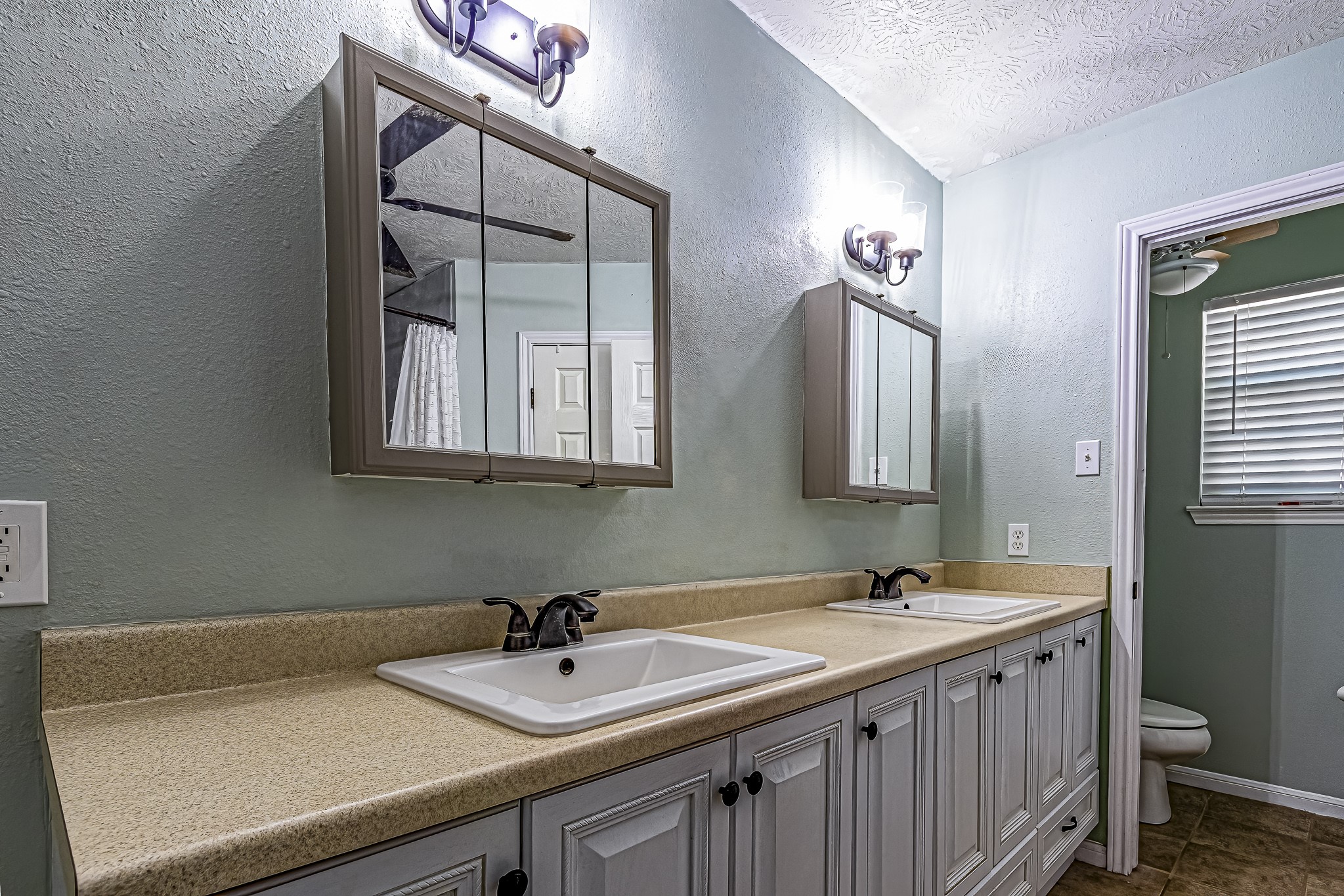 12 Quiet Wind Trinity, TX 75862 - Photo 36 of 47 a bathroom with a sink and a mirror