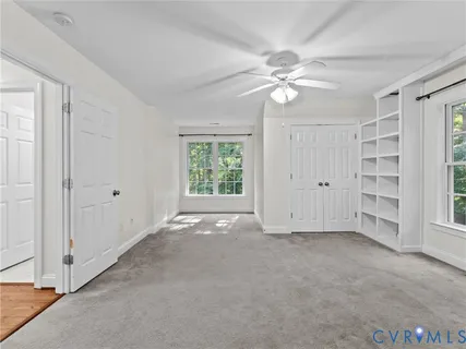 a view of an entryway with wooden floor