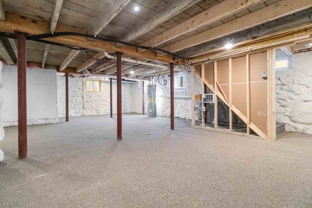 12 Cottage Street Stoneham, MA 02180 - Photo 15 of 16 a view of an empty room with stairs