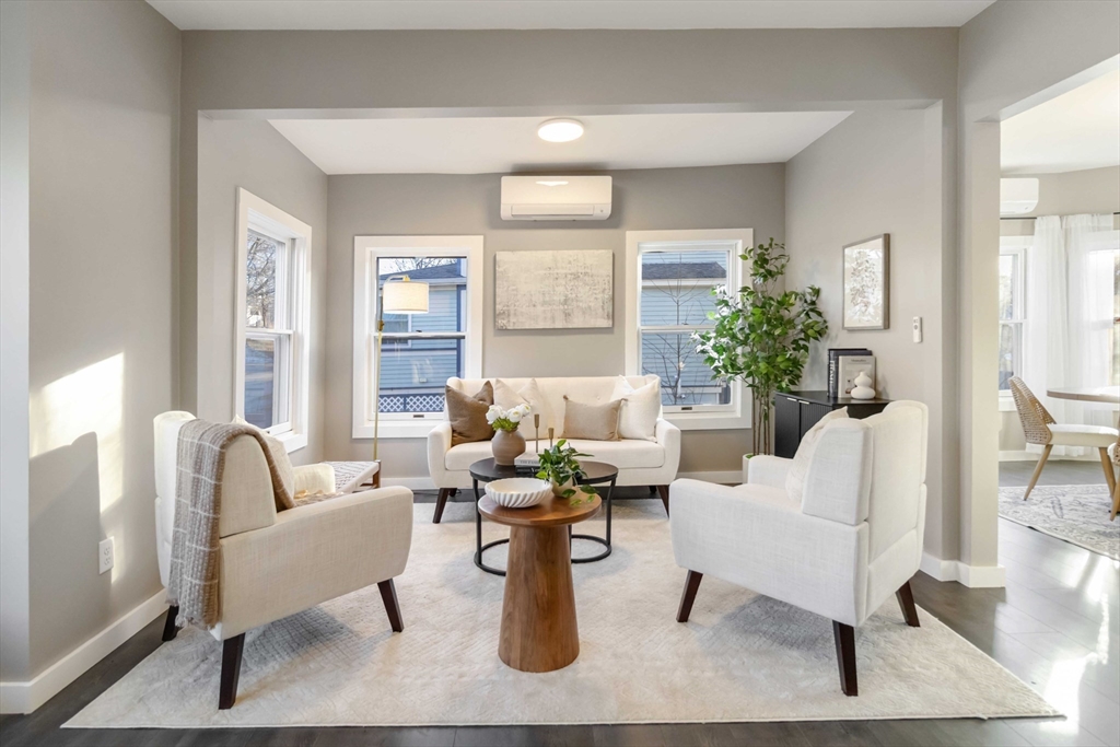 12 Cottage Street Stoneham, MA 02180 - Photo 2 of 16 a living room with furniture and wooden floor