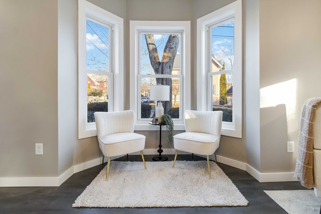 12 Cottage Street Stoneham, MA 02180 - Photo 6 of 16 a living room with furniture and a window