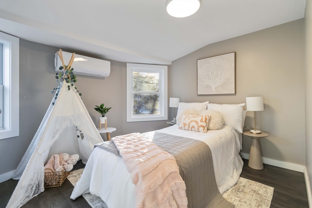 12 Cottage Street Stoneham, MA 02180 - Photo 9 of 16 a bedroom with a bed and a window