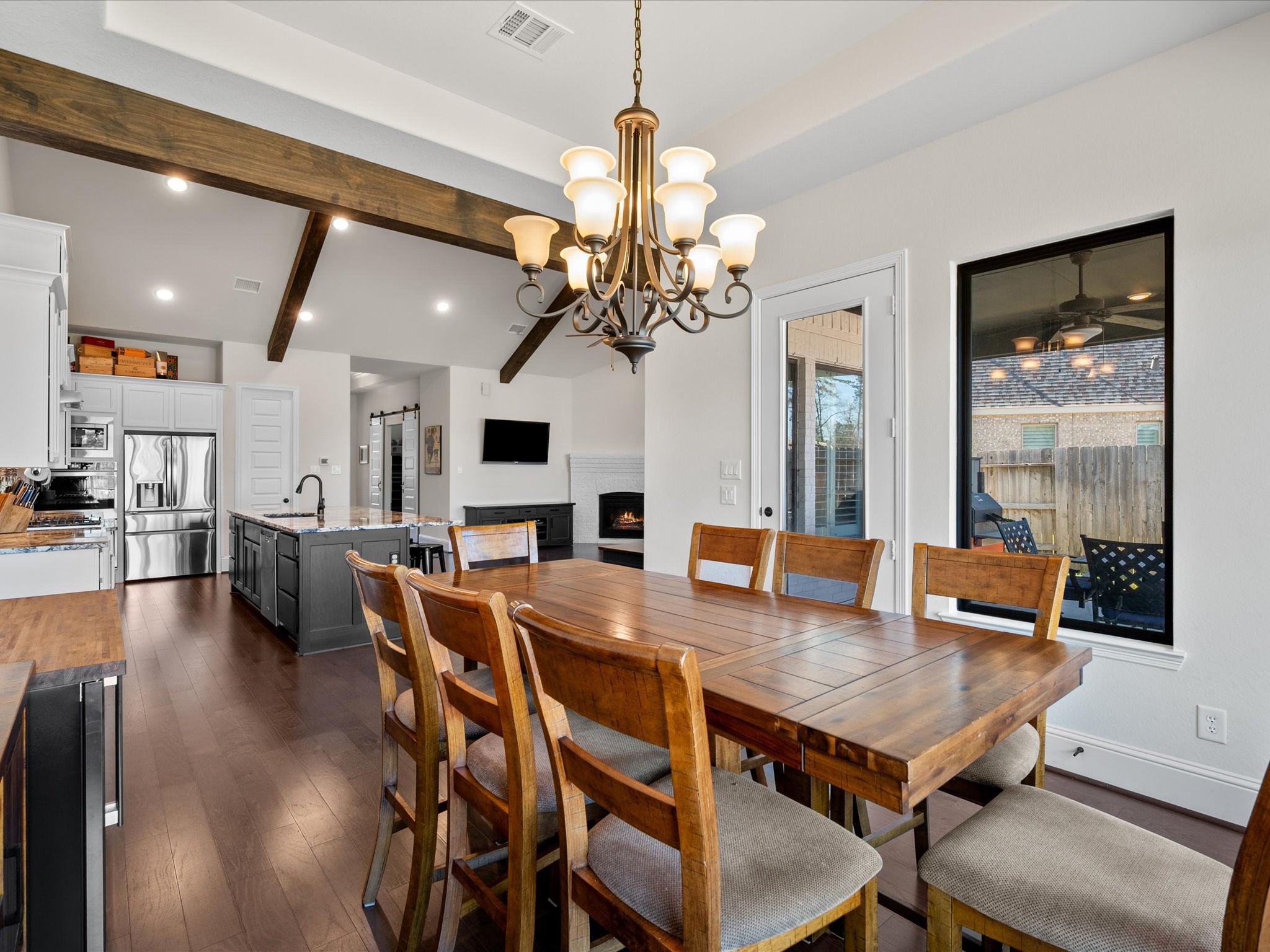 605 Ashbrook Ridge Lane Pinehurst, TX 77362 - Photo 20 of 46 With the dining area flowing naturally into the kitchen, everyday meals and entertaining feel seamless and connected.