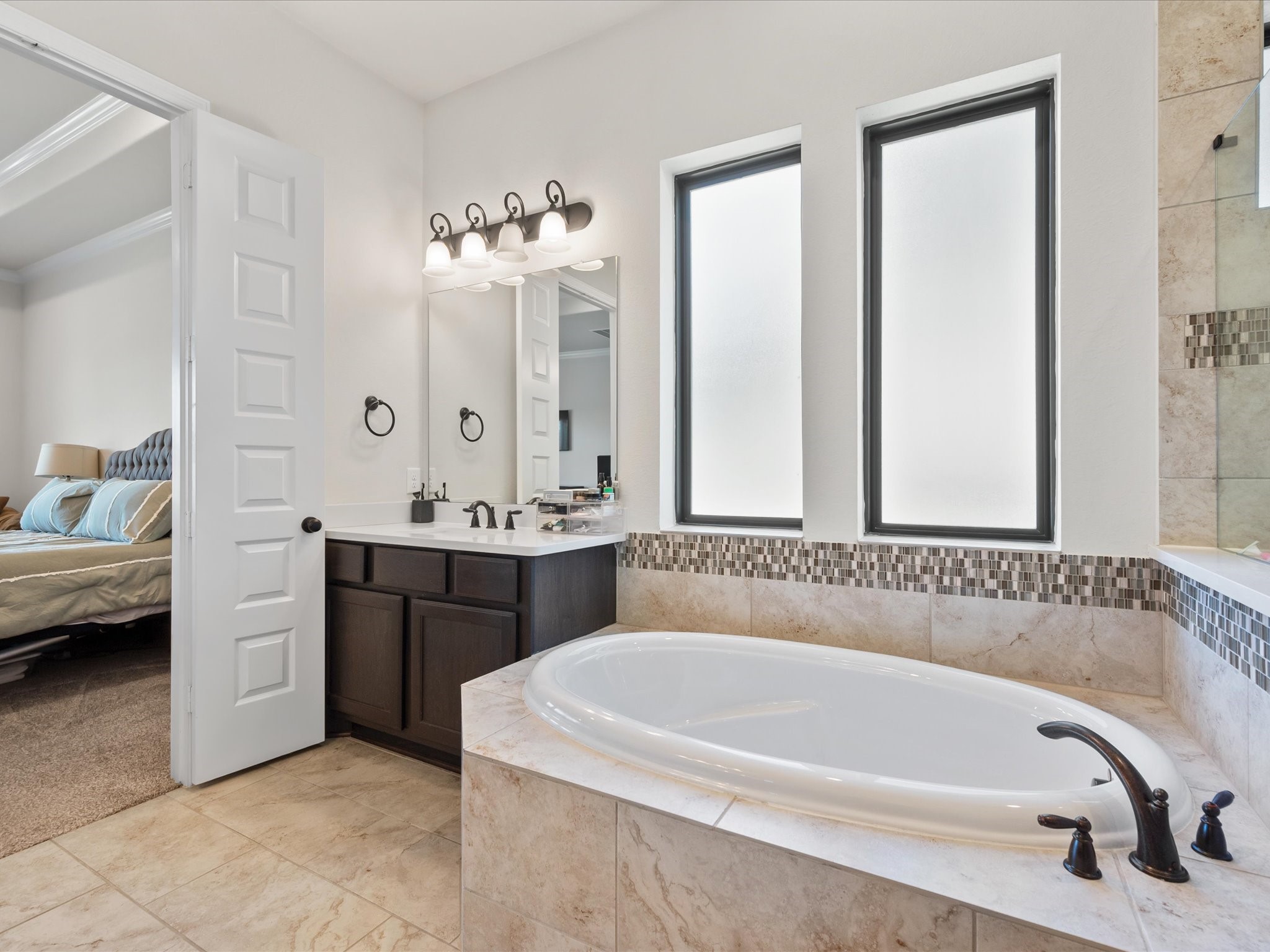 605 Ashbrook Ridge Lane Pinehurst, TX 77362 - Photo 24 of 46 Take a relaxing soak in the tub and let the day melt away.