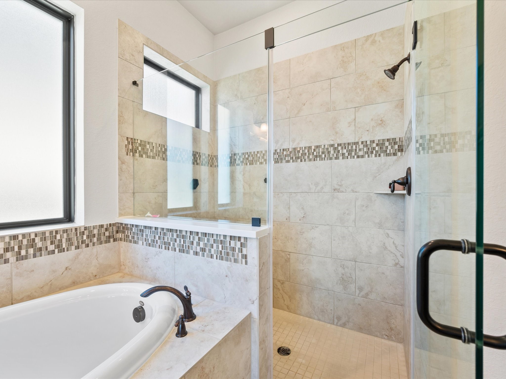 605 Ashbrook Ridge Lane Pinehurst, TX 77362 - Photo 26 of 46 The walk-in shower provides a sleek and spacious design for everyday comfort.