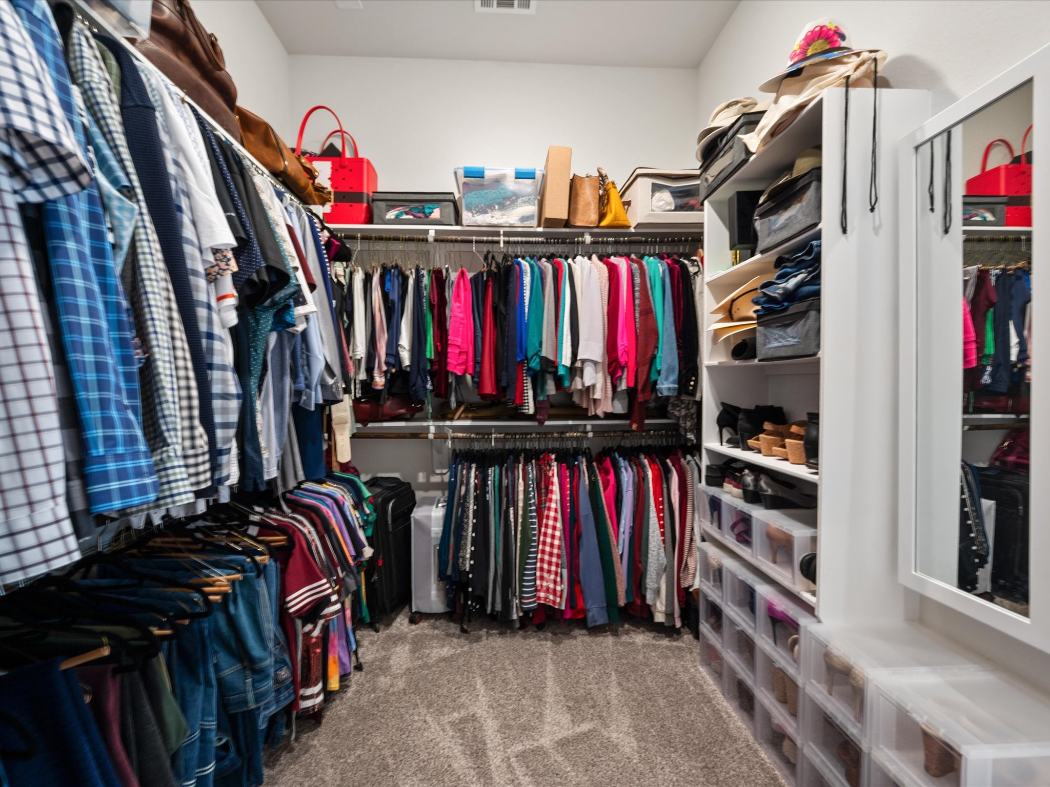 605 Ashbrook Ridge Lane Pinehurst, TX 77362 - Photo 27 of 46 A large walk-in closet with partial built-ins offers both storage and organization.
