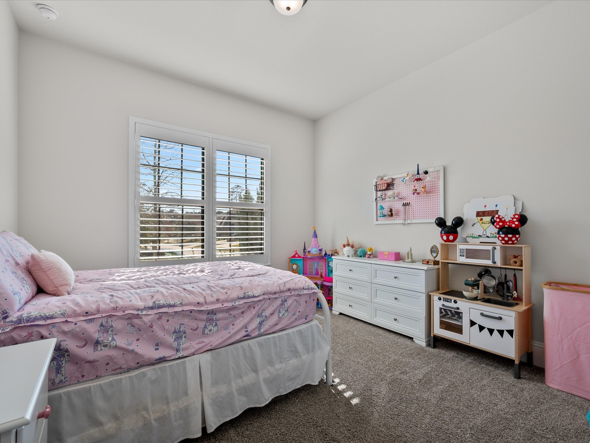 605 Ashbrook Ridge Lane Pinehurst, TX 77362 - Photo 29 of 46 Secondary bedrooms are generously sized, offering comfort and privacy for family or guests.